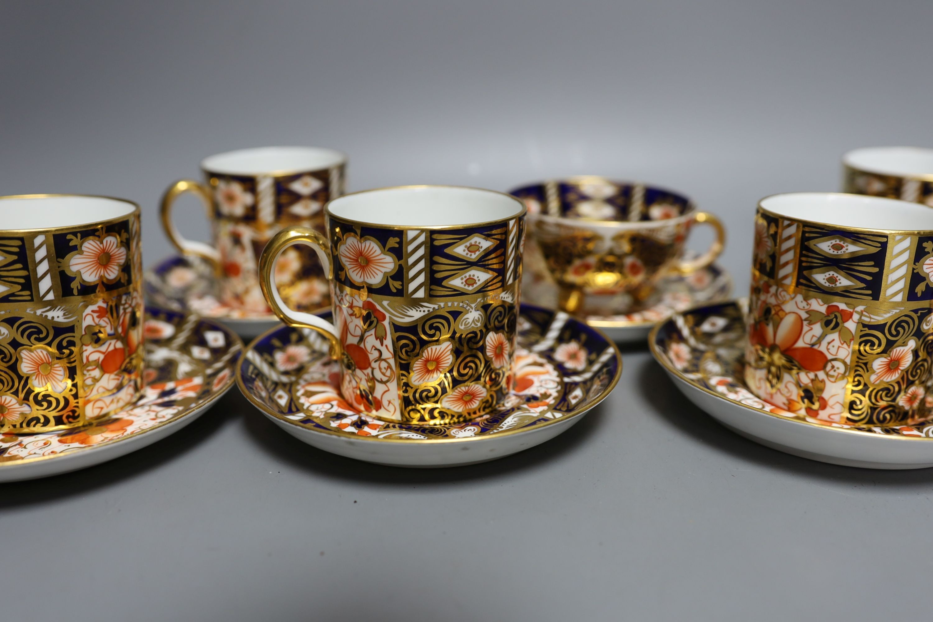 A Royal Crown Derby 6 set of coffee cans, 7 saucers and a similar Davenport cup and saucer (14)